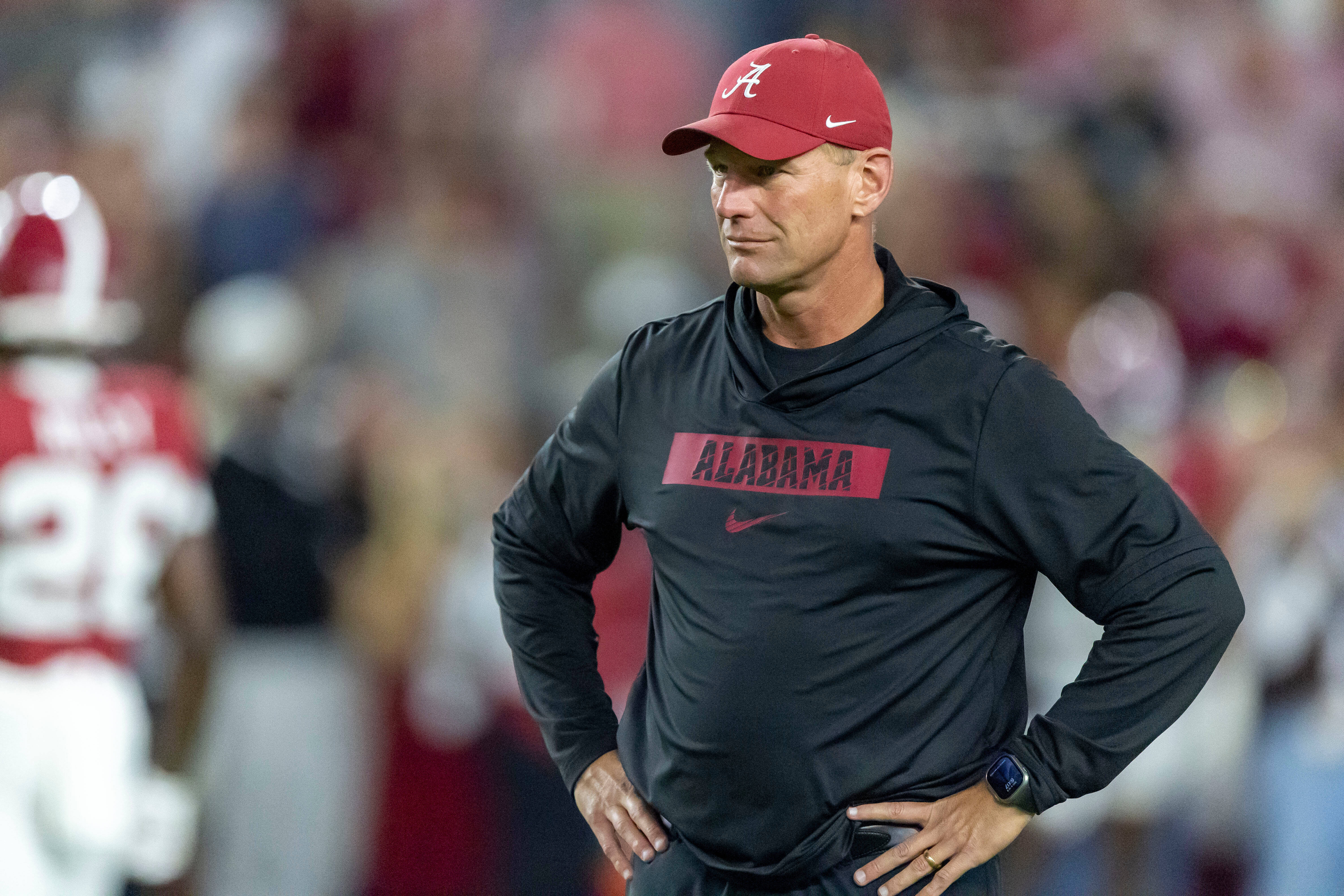 Alabama head coach Kalen DeBoer watches his team warm up before an NCAA college football game against LSU, Saturday, Nov. 8, 2025, in Tuscaloosa, Ala. (AP Photo/Vasha Hunt)