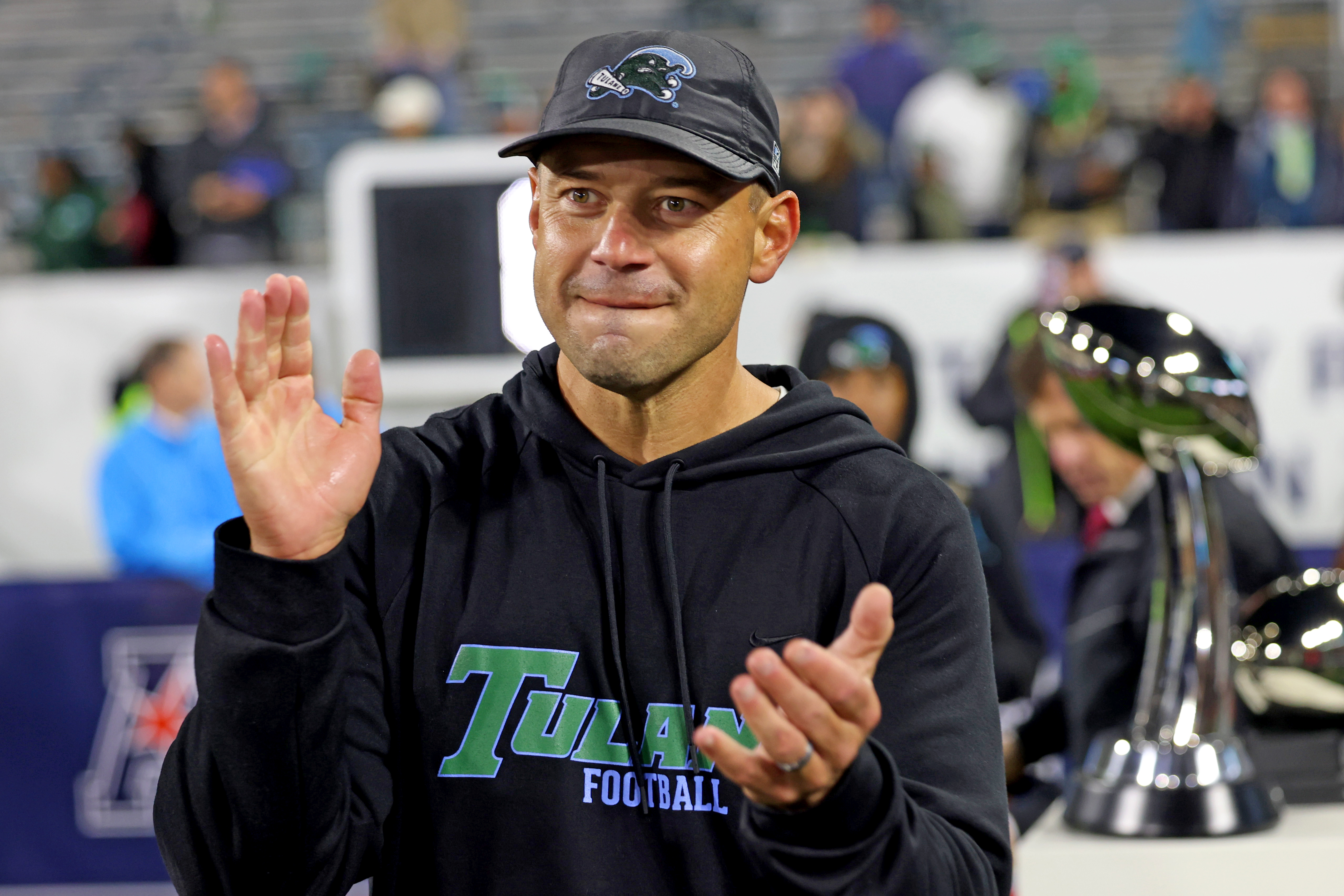 NEW ORLEANS, LOUISIANA - DECEMBER 5: Head coach Jon Sumrall of the Tulane Green Wave acknowledges the crowd at the trophy presentation after his team defeated the North Texas Mean Green 34-21 during the 2025 American Conference Football Championship at Yulman Stadium on December 5, 2025 in New Orleans, Louisiana. (Photo by Michael DeMocker/Getty Images)