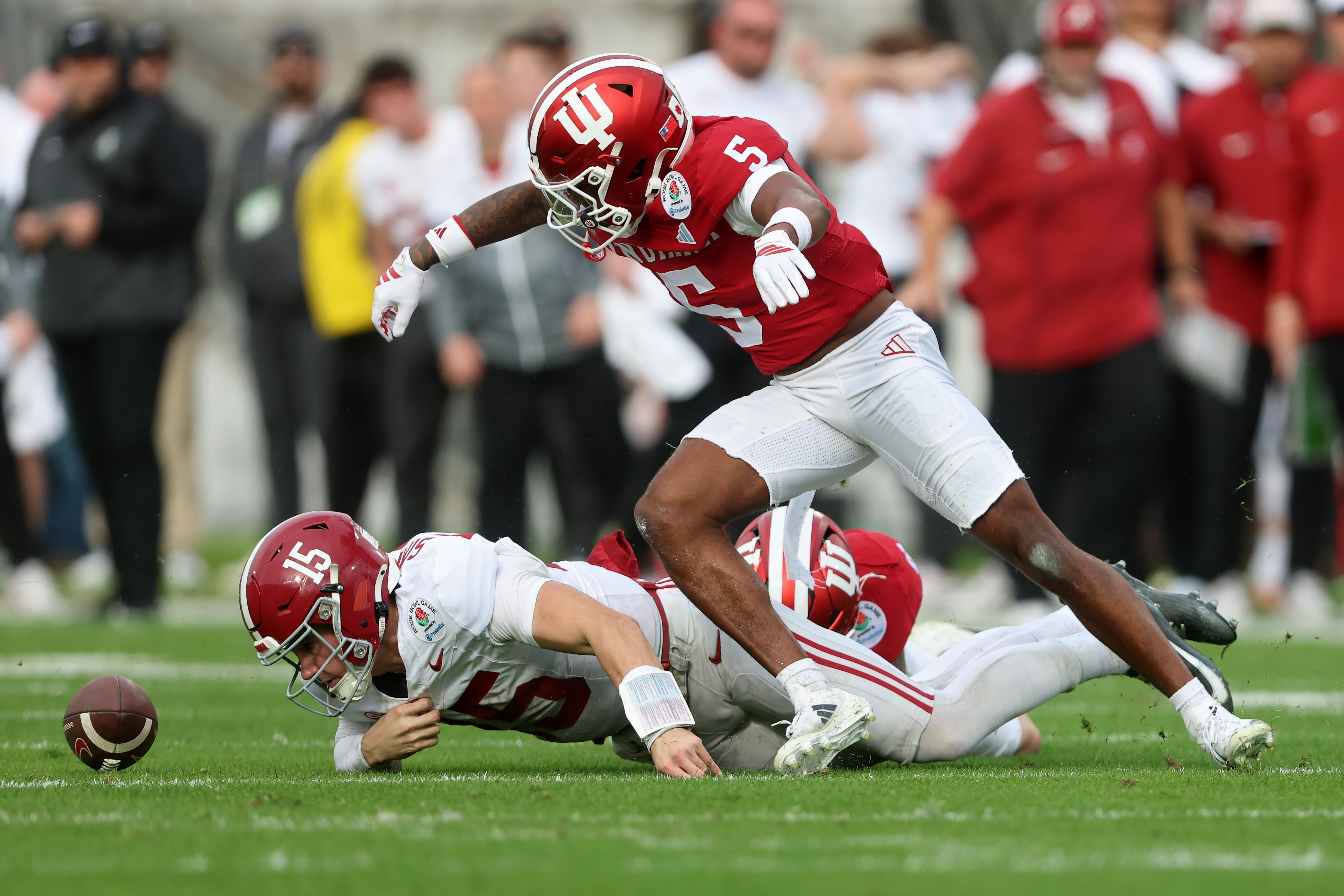 PASADENA, CALIFORNIA - JANUARY 01: D'Angelo Ponds #5 of the Indiana Hoosiers forces a fumble by Ty Simpson #15 of the Alabama Crimson Tide in the second quarter in the College Football Playoff Quarterfinal at Rose Bowl Stadium on January 01, 2026 in Pasadena, California. (Photo by Sean M. Haffey/Getty Images)