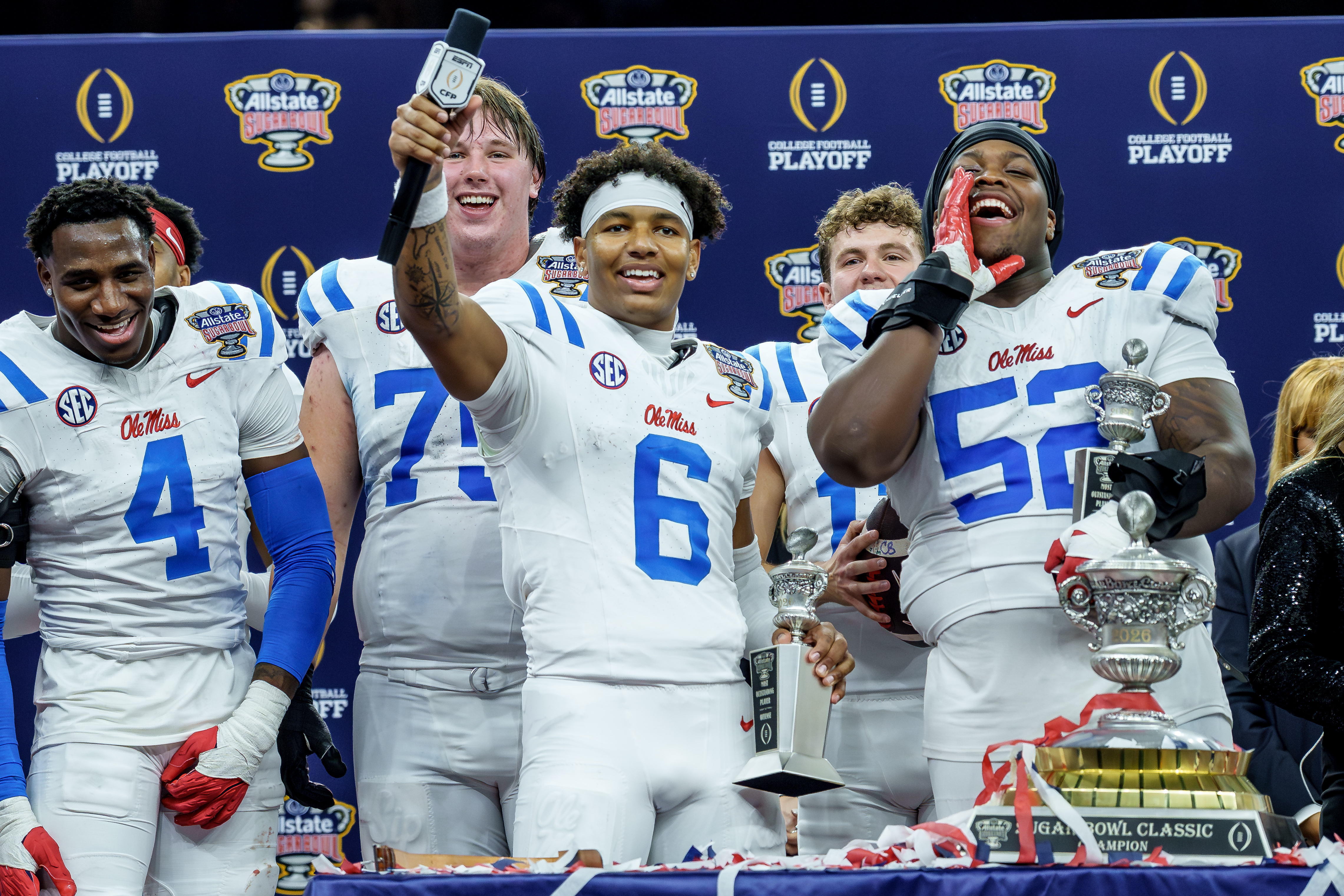 Mississippi quarterback Trinidad Chambliss (6) and Mississippi defensive tackle Will Echoles (52) talk at the crowd after defeating Georgia in the Sugar Bowl NCAA college football playoff quarterfinal game, Thursday, Jan. 1, 2026, in New Orleans. (AP Photo/Matthew Hinton)