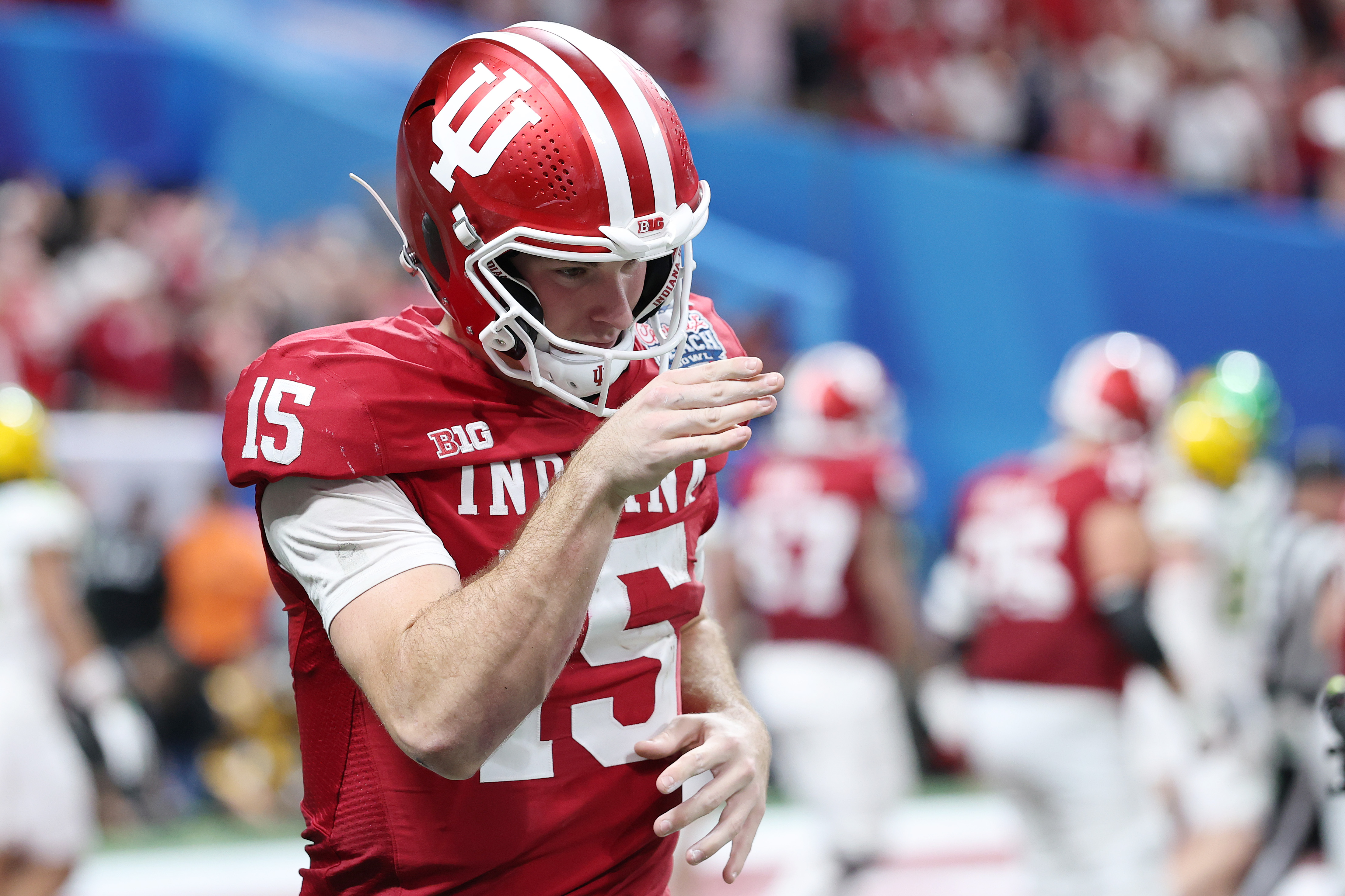 ATLANTA, GEORGIA - JANUARY 09: Fernando Mendoza #15 of the Indiana Hoosiers reacts after throwing a touchdown pass against the Oregon Ducks during the fourth quarter in the 2025 College Football Playoff Semifinal at the Chick-fil-A Peach Bowl at Mercedes-Benz Stadium on January 09, 2026 in Atlanta, Georgia. (Photo by Kevin C. Cox/Getty Images)