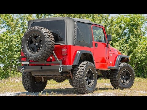 https://ewr1.vultrobjects.com/sema-data-images/DHTP/tj-rear-bumper-tire-carrier-install.jpg