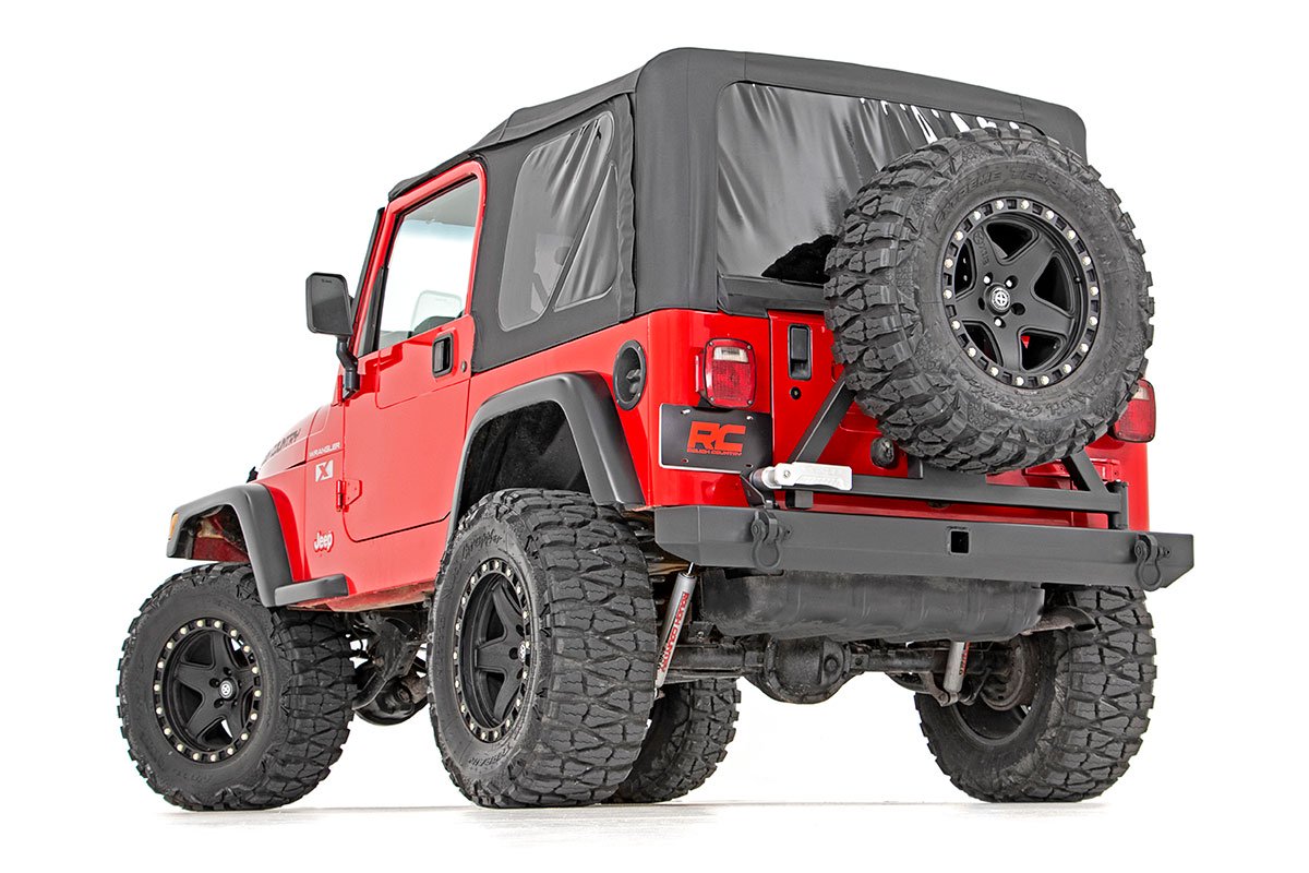https://ewr1.vultrobjects.com/sema-data-images/DHTP/tj-rear-bumper-tire-carrier-install.jpg