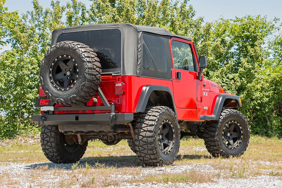 https://ewr1.vultrobjects.com/sema-data-images/DHTP/tj-rear-bumper-tire-carrier-install.jpg