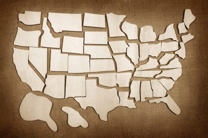 A third of the U.S. economy is already in a recession or at high risk, and another third is stagnating, Zandi warns