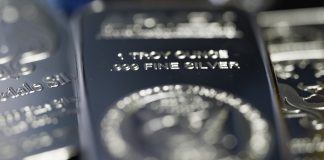 Silver pulls back after topping $80 in historic year-end rally