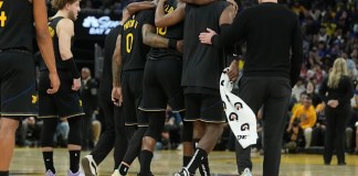 Warriors guard Jimmy Butler goes down with right knee injury in 3rd quarter against Heat