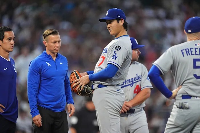 Dodgers’ Ohtani roughed up by Rockies and leaves game after getting hit on knee by line drive Dodgers’ Ohtani roughed up by Rockies and leaves game after getting hit on knee by line drive