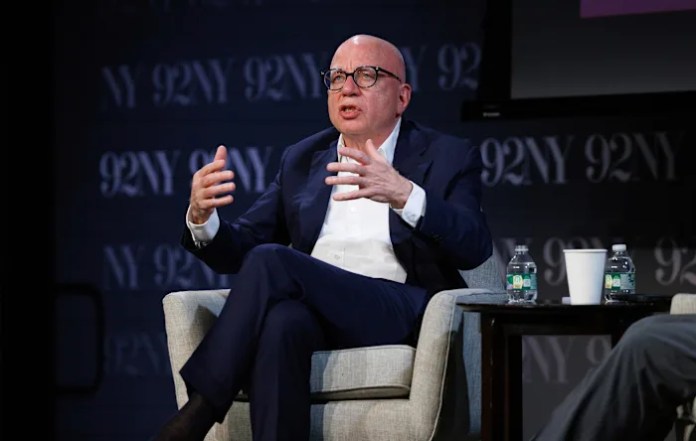 Author Michael Wolff sues Melania Trump, saying she threatened $1B suit over Epstein-related claims