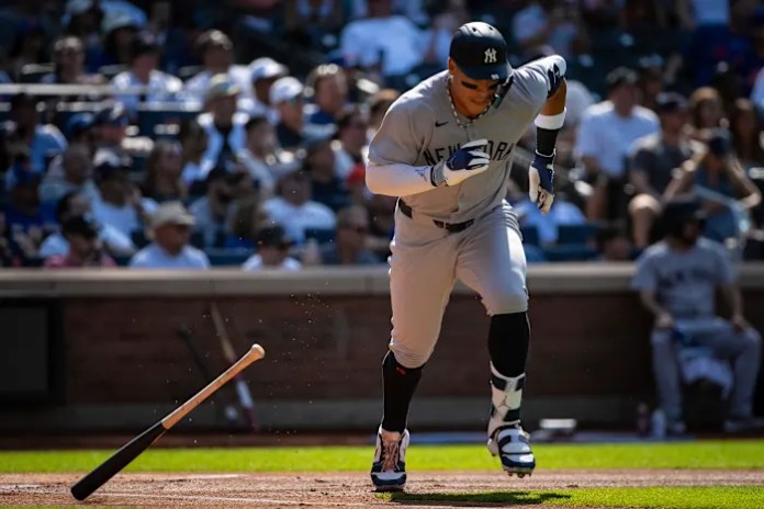 Aaron Judge gets struck in the face by a toss from Yankees teammate Anthony Volpe