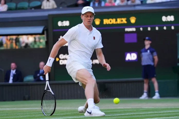 Jannik Sinner starts his Wimbledon quarterfinal against Ben Shelton with a sleeve on his hurt elbow