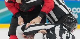 Tom Wilson fights in Canada’s game vs. France at the Olympics