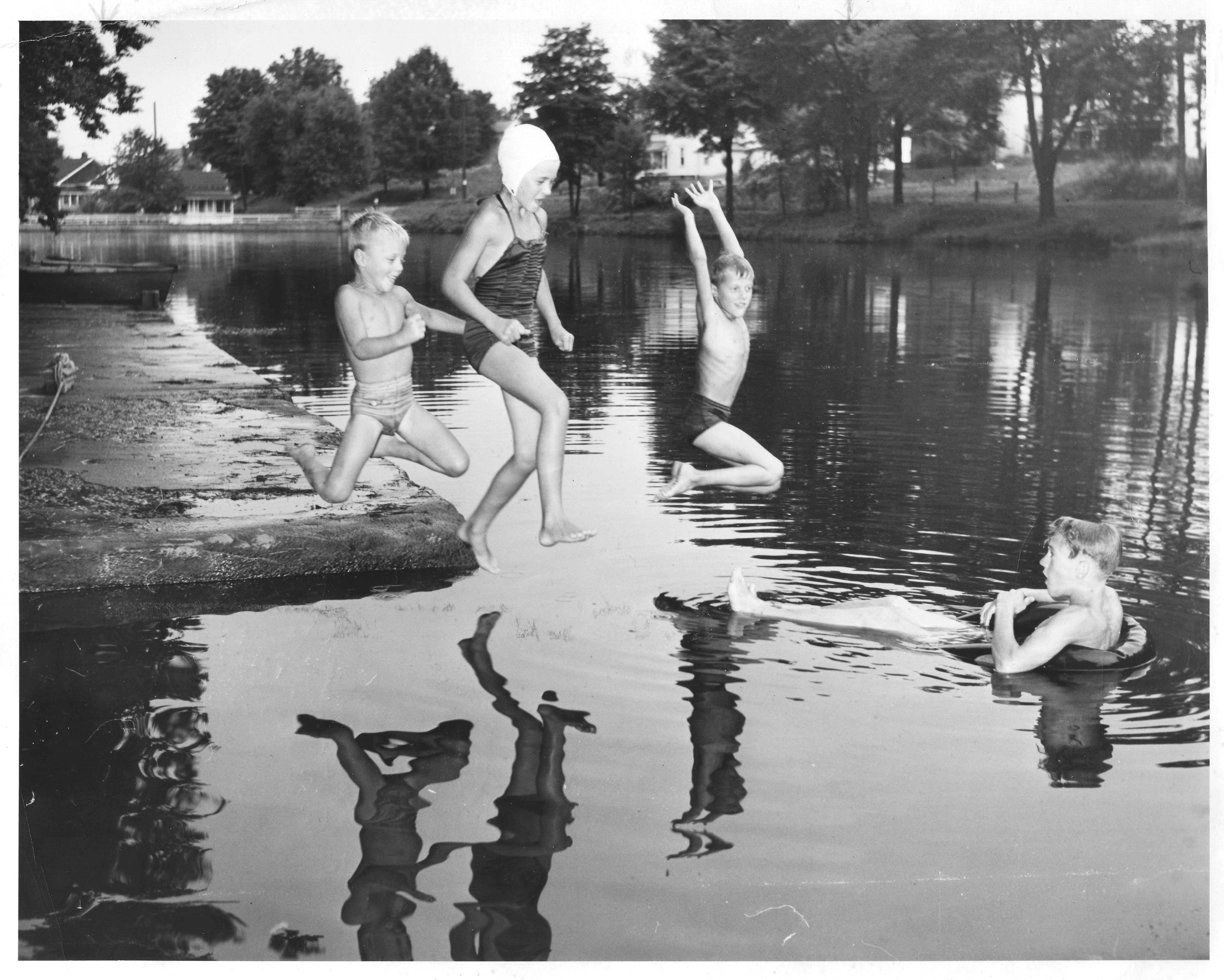 Lake with kids jumping in Lake with kids jumping in