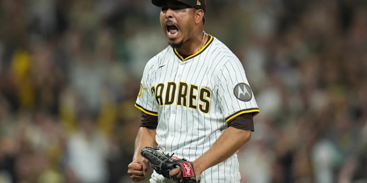 Padres clinch playoff spot with extra-innings victory over Brewers Padres clinch playoff spot with extra-innings victory over Brewers