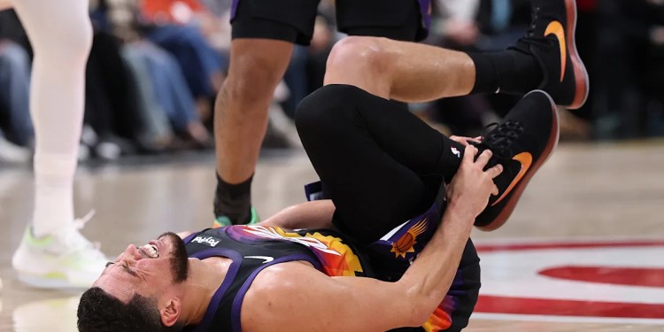 Devin Booker to be re-evaluated in one week Devin Booker to be re-evaluated in one week