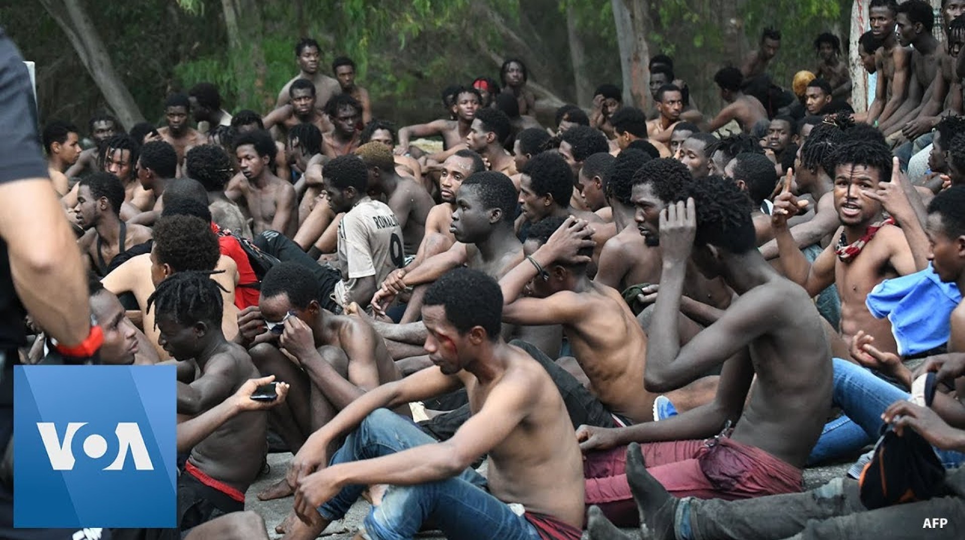 155 Migrants Jump Fence From Morocco to Spain | VOANews 155 Migrants Jump Fence From Morocco to Spain | VOANews