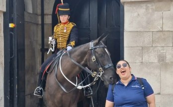 The Kings Guard Smirks at Horse Bites a Tourist Shoulder The Kings Guard Smirks at Horse Bites a Tourist Shoulder