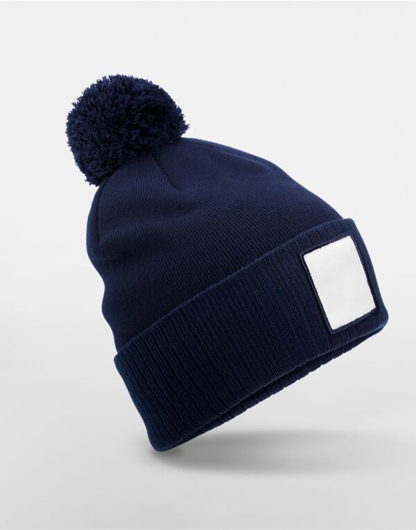 B338R Beechfield Appliqué Patch Pom Beanie Oxford Navy/White B338R Beechfield Appliqué Patch Pom Beanie Oxford Navy/White