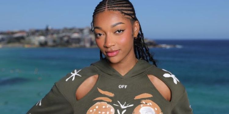 Angel Reese Nails Mob Wife Chic in Roberto Cavalli Dress Held up by Strings Angel Reese Nails Mob Wife Chic in Roberto Cavalli Dress Held up by Strings