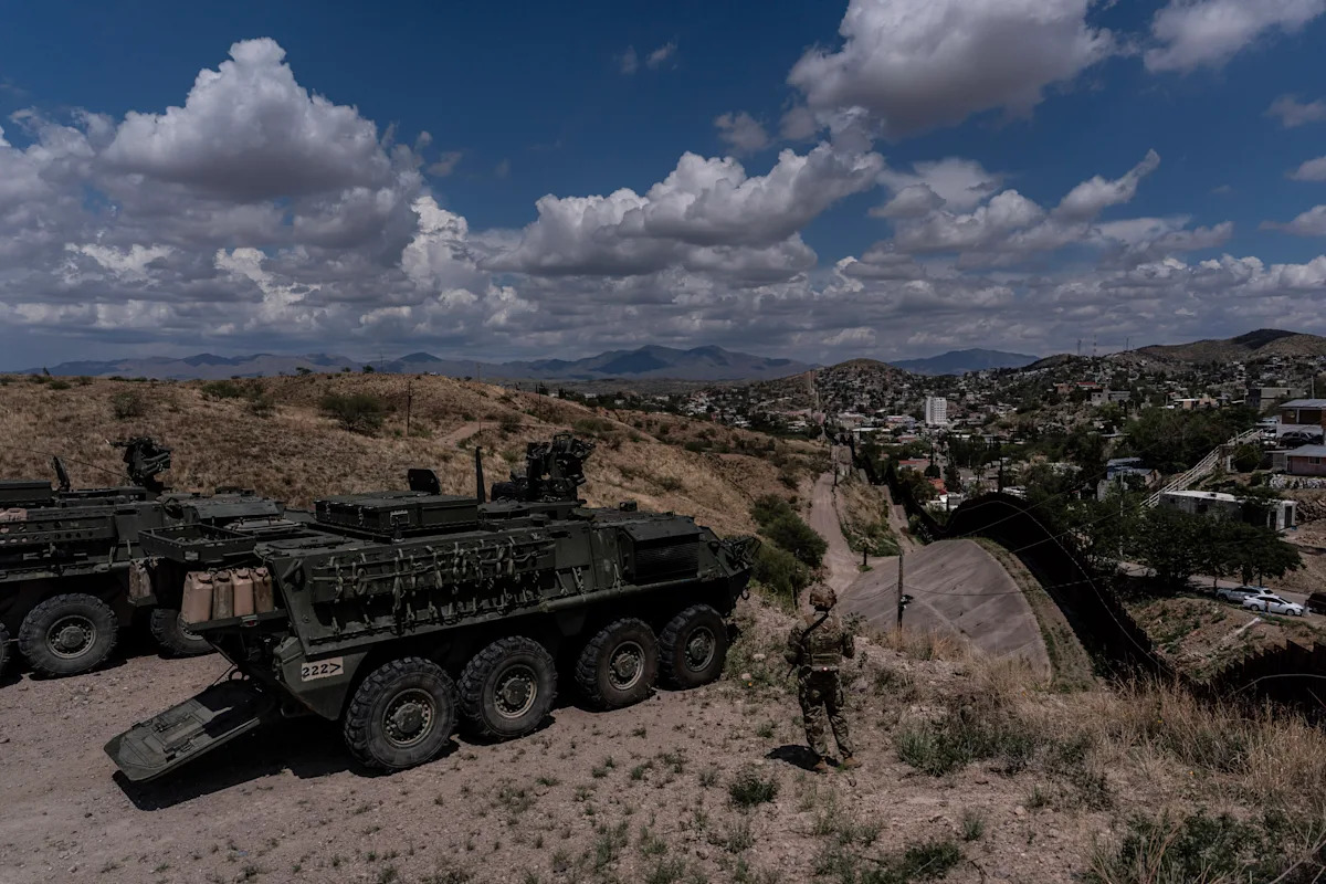 A person is halted climbing the US-Mexico border wall. Below new Trump guidelines, US troops sound the alarm A person is halted climbing the US-Mexico border wall. Below new Trump guidelines, US troops sound the alarm