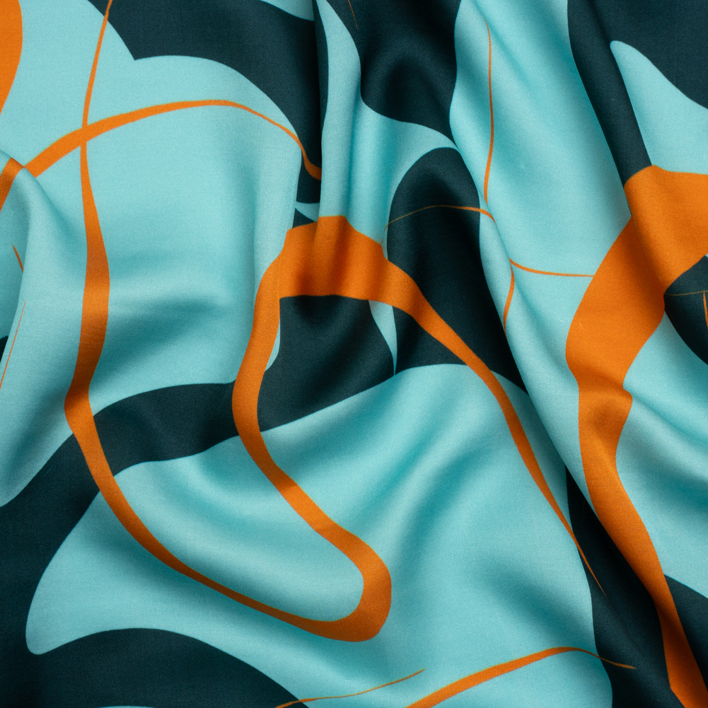 Sustainable and Recycled Viscose Satin Print – Turquoise and Orange Swirling Abstract – Mood Exclusive Atmospheric Adventure Sustainable and Recycled Viscose Satin Print – Turquoise and Orange Swirling Abstract – Mood Exclusive Atmospheric Adventure