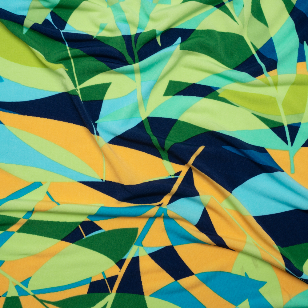 Stretch Polyester Tricot – Green, Blue and Goldenrod Overlapping Palm Leaves – Designer Deadstock Stretch Polyester Tricot – Green, Blue and Goldenrod Overlapping Palm Leaves – Designer Deadstock