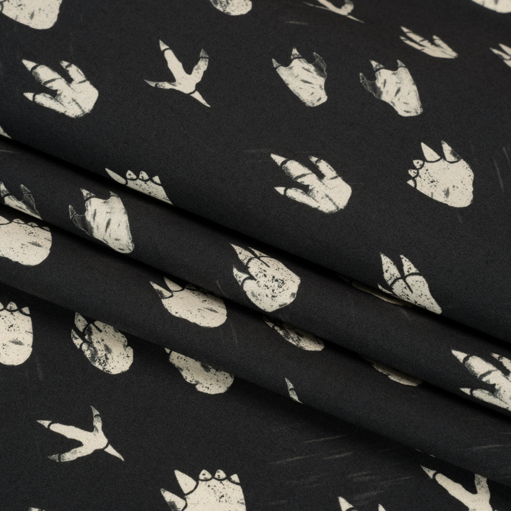 Stretch Cotton Poplin Print – Black Dinosaur Footprints – Mood Exclusive Jurassic Jubilee Stretch Cotton Poplin Print – Black Dinosaur Footprints – Mood Exclusive Jurassic Jubilee