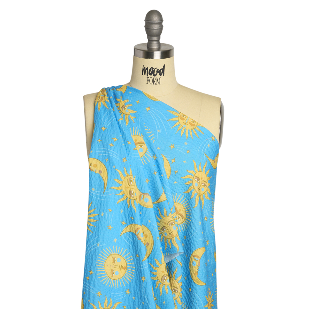 Cotton and Viscose Striped Seersucker Print – Sky Blue Suns and Moons – Mood Exclusive Friendly Faces Cotton and Viscose Striped Seersucker Print – Sky Blue Suns and Moons – Mood Exclusive Friendly Faces