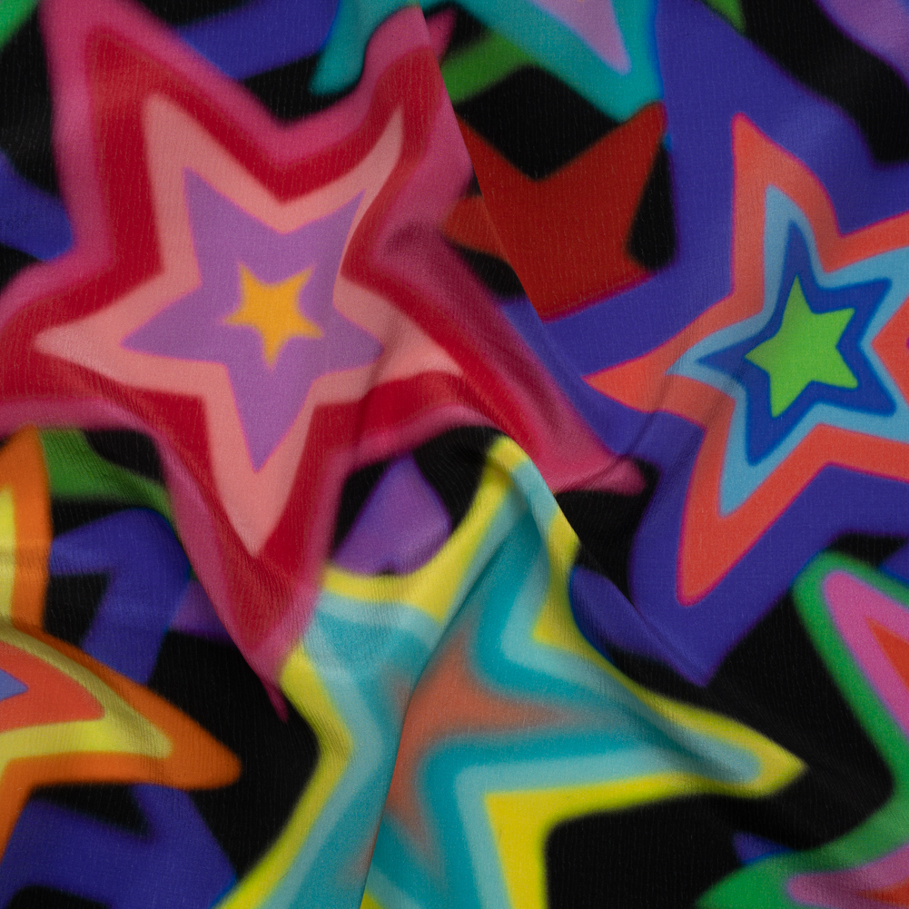 Crinkled Silk Crepe de Chine Print Made in Italy – Rainbow on Black Stars – Deadstock Crinkled Silk Crepe de Chine Print Made in Italy – Rainbow on Black Stars – Deadstock