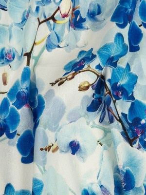 Tilted Blue Orchids and Lily White Printed Stretch Linen and Rayon Woven Tilted Blue Orchids and Lily White Printed Stretch Linen and Rayon Woven