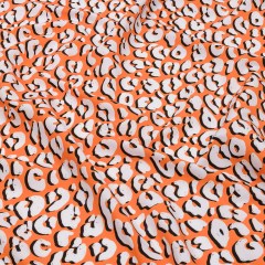 Recycled Polyester Swim Trunk Fabric – Orange and White Animal Spots – Dune Surfing Print – Mood Exclusive Malibu Collection Recycled Polyester Swim Trunk Fabric – Orange and White Animal Spots – Dune Surfing Print – Mood Exclusive Malibu Collection