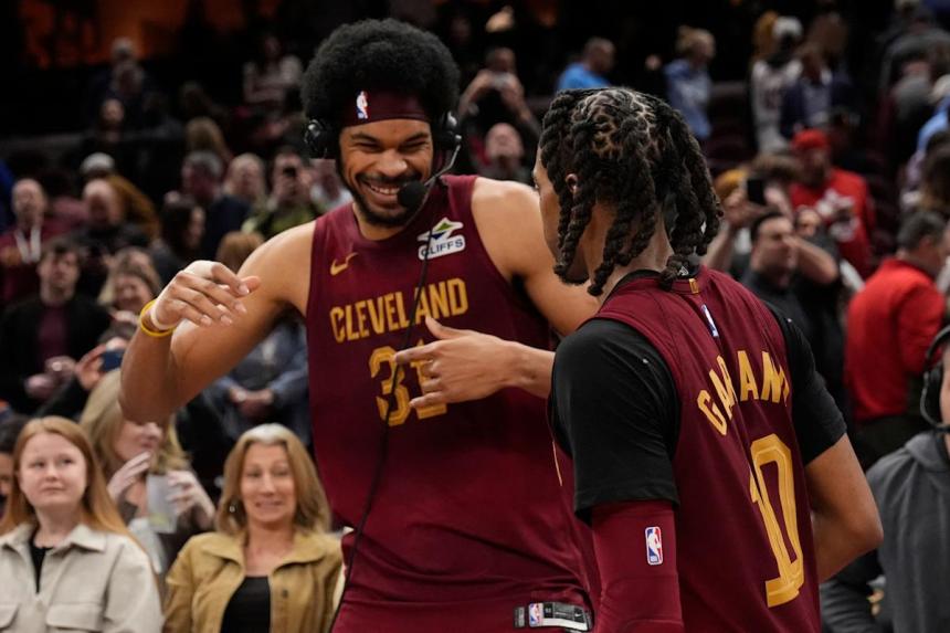 Cavaliers rally from 18-point deficit, clinch Central Division with 109-104 win over Nets Cavaliers rally from 18-point deficit, clinch Central Division with 109-104 win over Nets