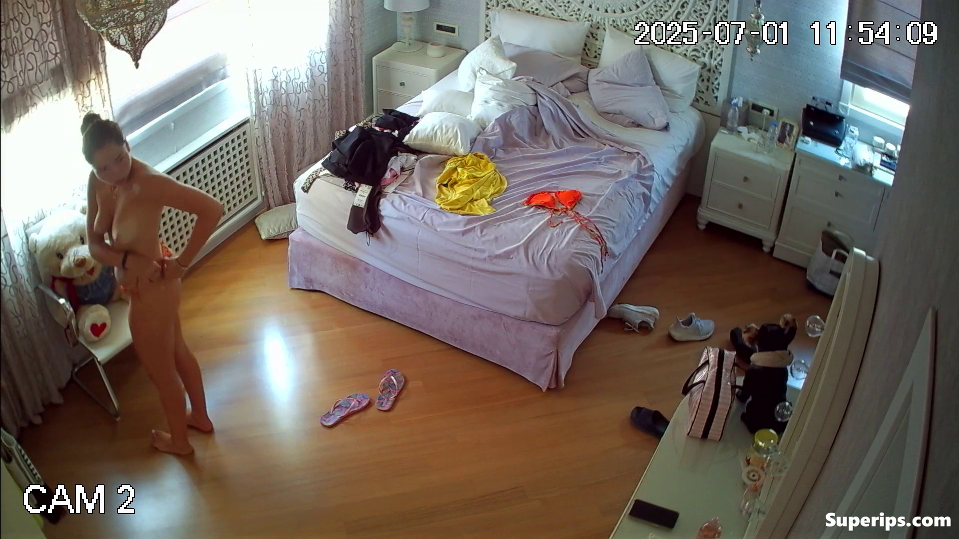 IPCAM – Tanned German girl changes her bikini IPCAM – Tanned German girl changes her bikini