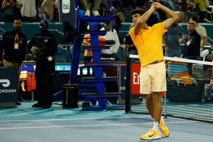 Carlos Alcaraz hits golf swing celebration with Rory McIlroy watching Carlos Alcaraz hits golf swing celebration with Rory McIlroy watching