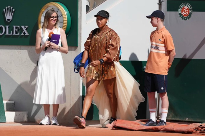Osaka adds an ivory train and gold bomber jacket to her fashion ensemble at the French Open Osaka adds an ivory train and gold bomber jacket to her fashion ensemble at the French Open
