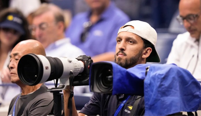 Basketball player Landry Shamet takes his shots as a photographer working at the US Open Basketball player Landry Shamet takes his shots as a photographer working at the US Open