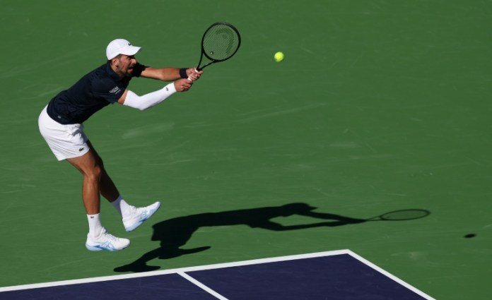 Djokovic battles back to win Indian Wells opener Djokovic battles back to win Indian Wells opener