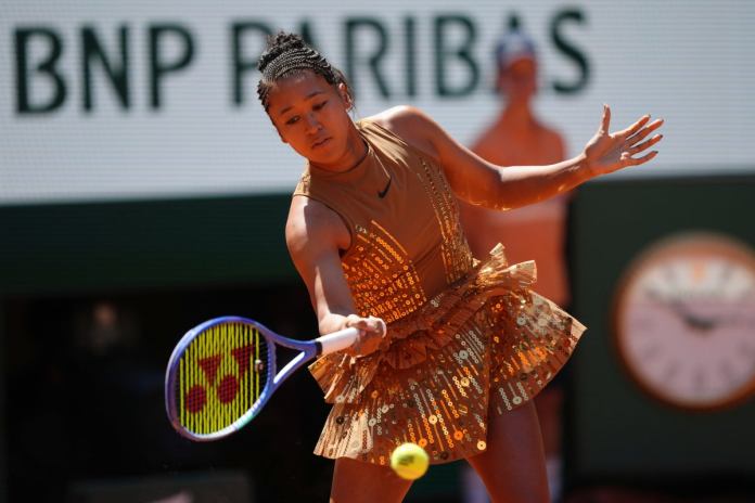 Naomi Osaka turns heads at French Open with Eiffel Tower-inspired gold dress Naomi Osaka turns heads at French Open with Eiffel Tower-inspired gold dress