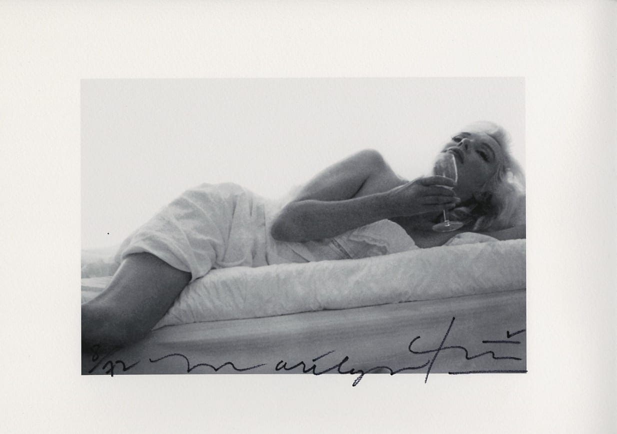 Bert Stern – Marilyn Monroe drinking wine on the bed