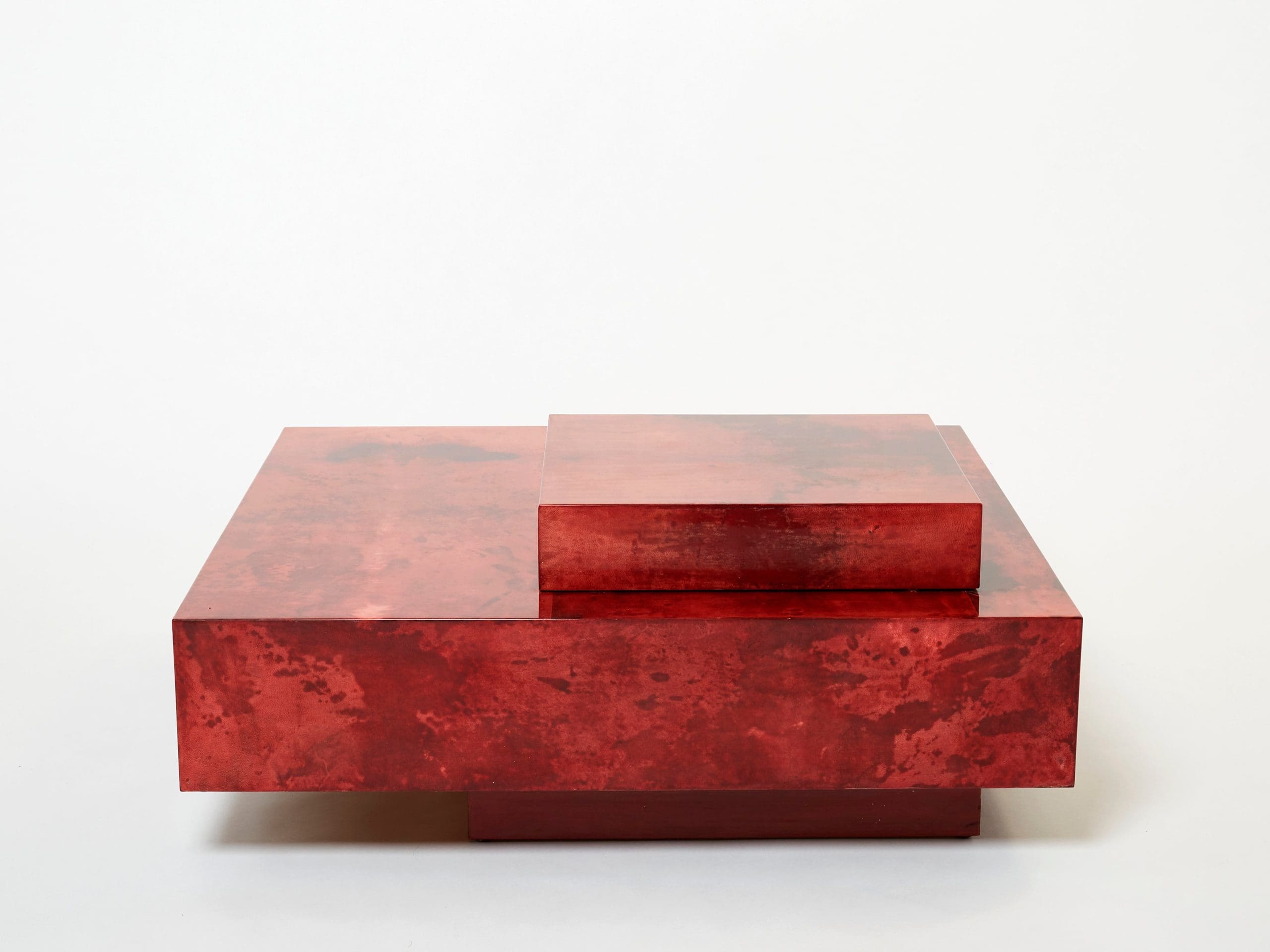 Table basse Aldo Tura en parchemin de chèvre rouge cerise et acier, années 1960