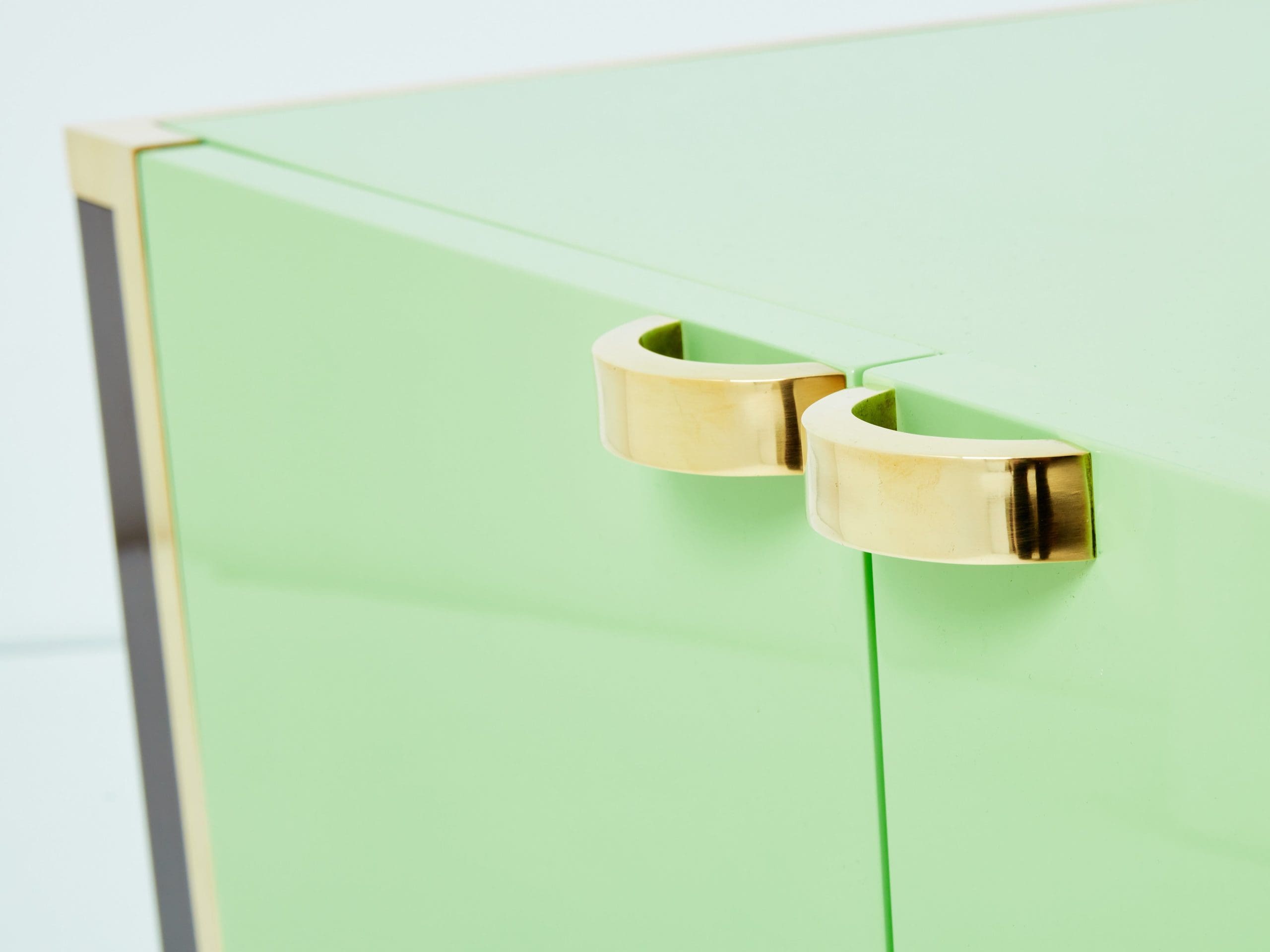 J.C. Mahey pair of small green lacquer and brass cabinets 1970s