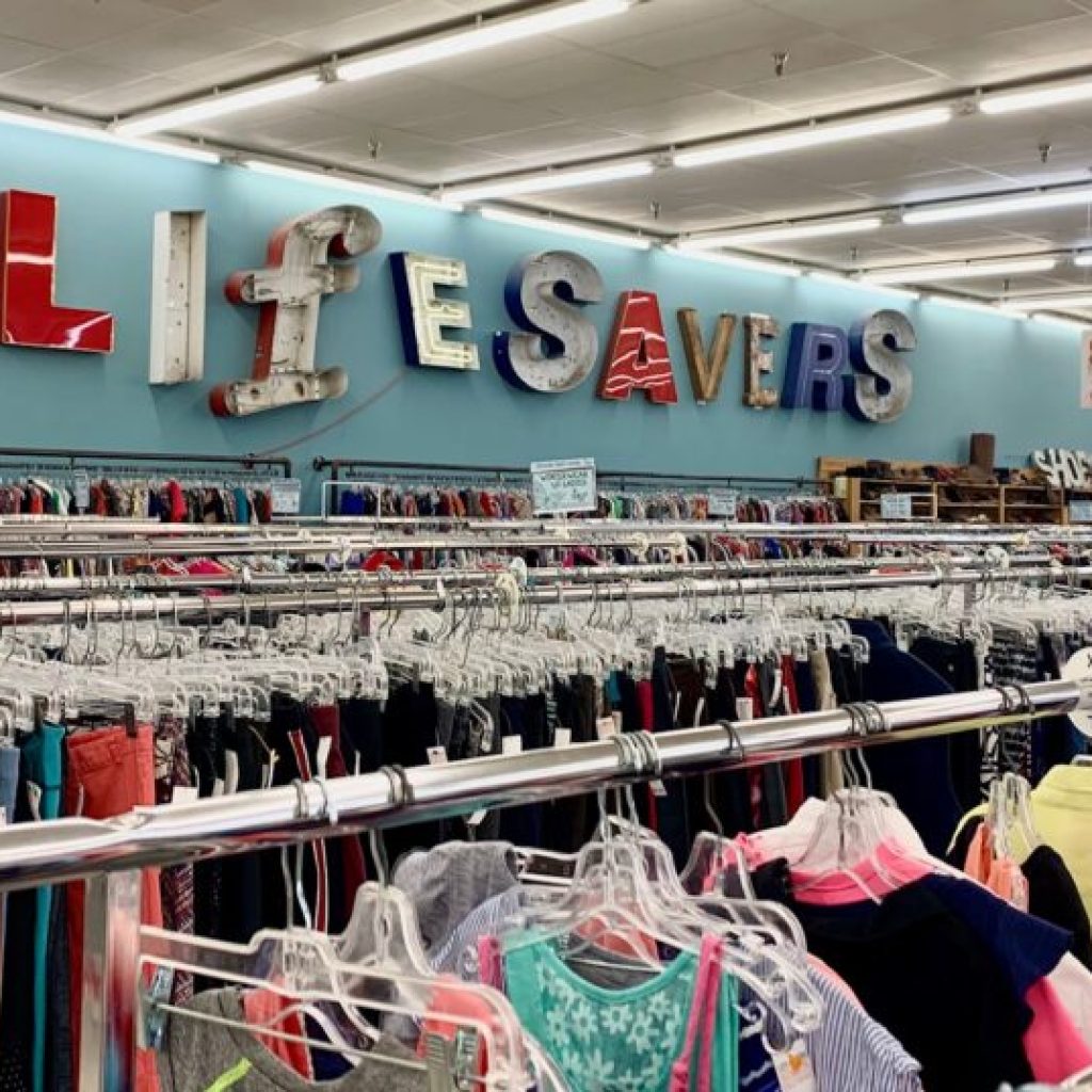 Inside Lifesavers Mission Thrift Store in Auburn, Alabama with racks of clothes. Inside Lifesavers Mission Thrift Store in Auburn, Alabama with racks of clothes.
