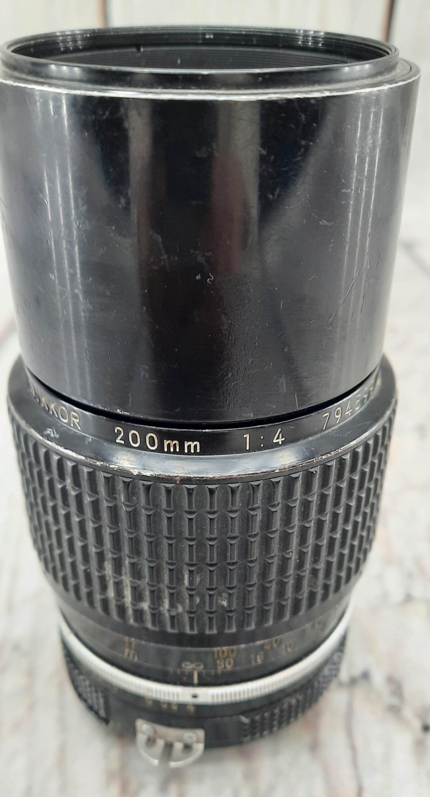 Nikon Nikkor 200mm 1:4 camera lens [Does have Normal Cosmetic Wear]