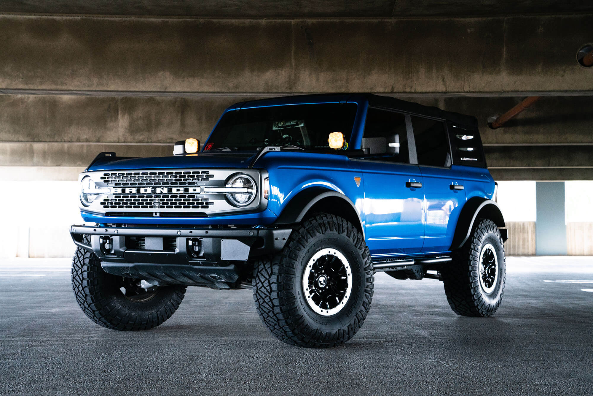 DV8 Offroad Front license plate relocation bracket places plate to the side of the bumper. LPBR-02