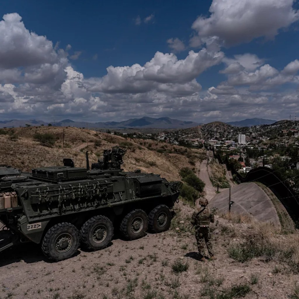 A person is halted climbing the US-Mexico border wall. Beneath new Trump guidelines, US troops sound the alarm A person is halted climbing the US-Mexico border wall. Beneath new Trump guidelines, US troops sound the alarm