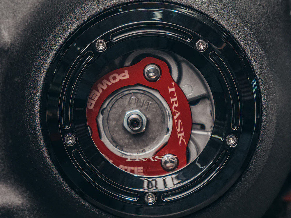 Trask Performance Assault Clear Derby Cover – Gloss Black. Fits Softail 2019up.