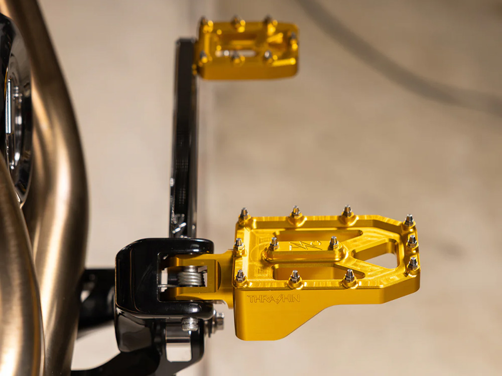 Thrashin Supply Aggressor Footpegs – Gold. Fits Softail 2018up Front Rider