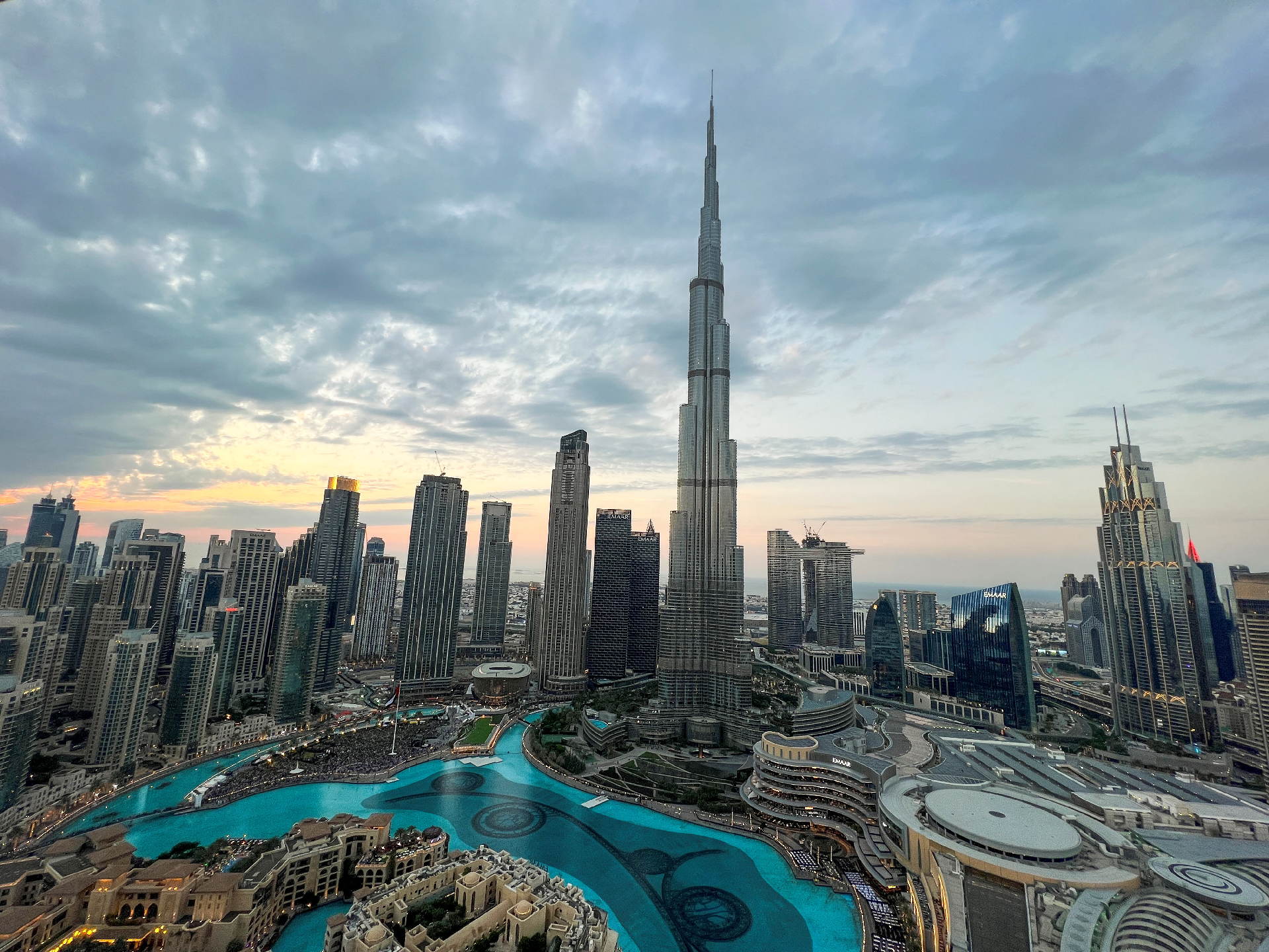 Aerial view of the UAE skyline showcasing modern skyscrapers and vibrant city architecture under a clear blue sky. Aerial view of the UAE skyline showcasing modern skyscrapers and vibrant city architecture under a clear blue sky.