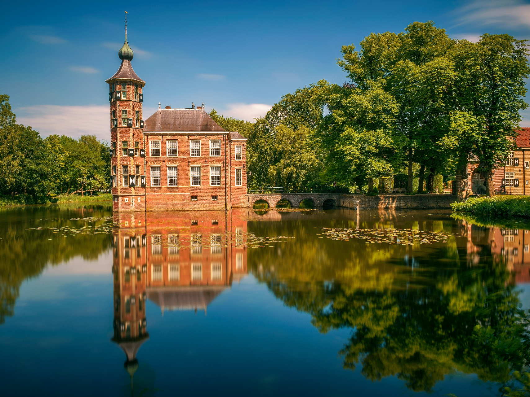 A picturesque view of Breda Castle in Breda, showcasing its elegant architecture and tranquil surroundings. A picturesque view of Breda Castle in Breda, showcasing its elegant architecture and tranquil surroundings.