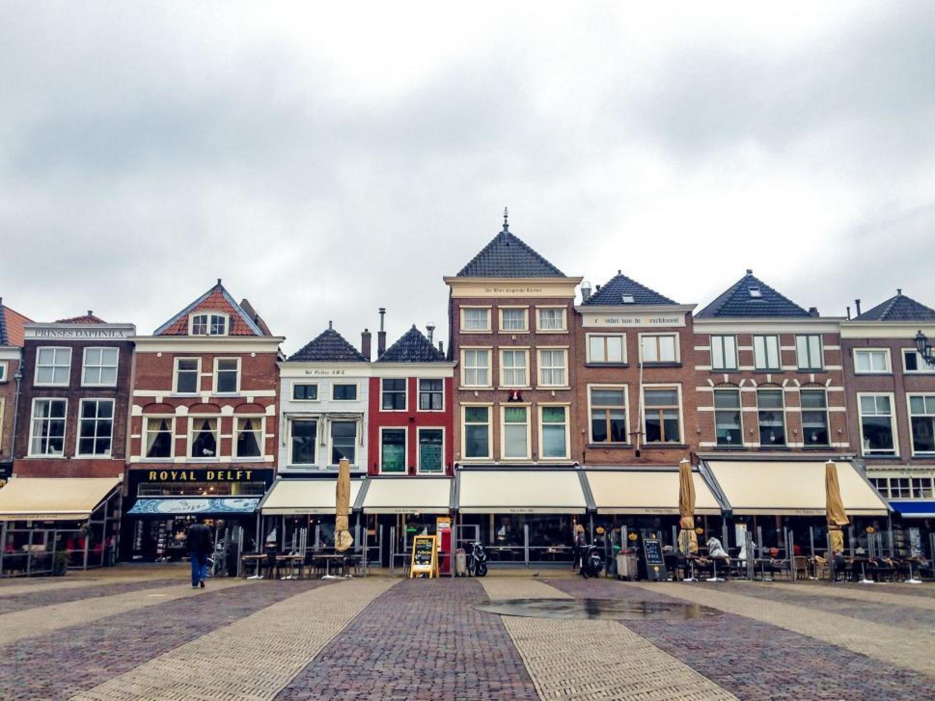 Historic cityscape of Dordrecht showcasing charming architecture and waterways under a clear blue sky. Historic cityscape of Dordrecht showcasing charming architecture and waterways under a clear blue sky.